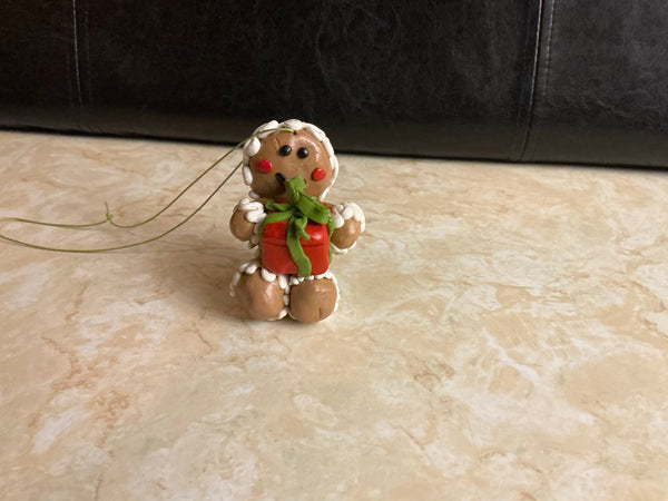 Polymer Clay Gingerbread Person Ornament — Holding a Christmas Gift